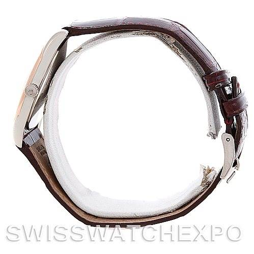 The image shows a side view of a Rolex Cellini 4233 Men's White Gold White Dial 4233 Men's White Gold White Dial watch, highlighting its brown leather strap and metal case.