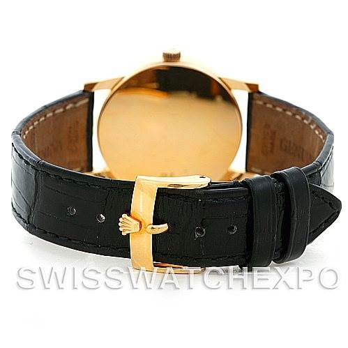 This image shows the back view of a Rolex Cellini 5116 Men's Yellow Gold Black Dial 5116 Men's Yellow Gold Black Dial watch, focusing on its black leather strap and gold buckle.