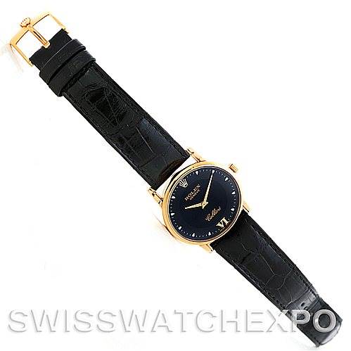 This image shows a Rolex Cellini 5116 Men's Yellow Gold Black Dial 5116 Men's Yellow Gold Black Dial watch from an overhead angle, featuring the watch face, black leather strap, and gold buckle.