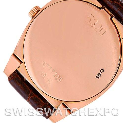 This image shows the case back and part of the strap of a Rolex Cellini 5320/5 Rose Gold White Dial 5320/5 Rose Gold White Dial watch.