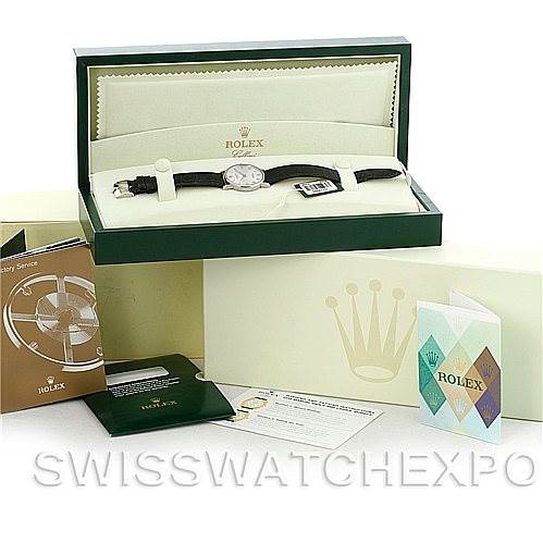 The image shows a Rolex Cellini 5115 Men's White Gold Silver Dial 5115 Men's White Gold Silver Dial watch in its open box, along with accompanying documents and accessories.
