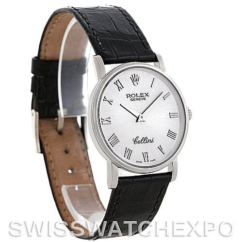 The image shows a Rolex Cellini 5115 Men's White Gold Silver Dial 5115 Men's White Gold Silver Dial watch at a slight angle, highlighting its black leather strap, silver case, and white dial with Roman numerals.