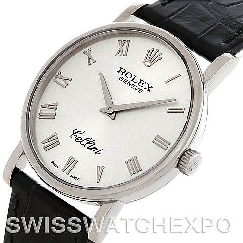 This image shows a Rolex Cellini 5115 Men's White Gold Silver Dial 5115 Men's White Gold Silver Dial watch viewed from an angled perspective, highlighting its face, Roman numeral indices, and leather strap.