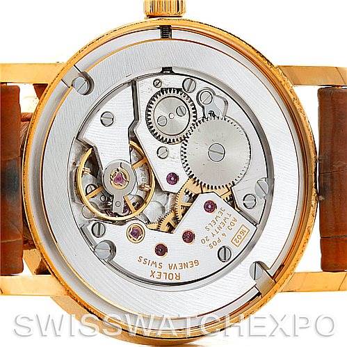 The image shows the open case back of a Rolex Cellini 5115 Men's Yellow Gold Beige Dial 5115 Men's Yellow Gold Beige Dial watch, revealing the intricate details of its mechanical movement.