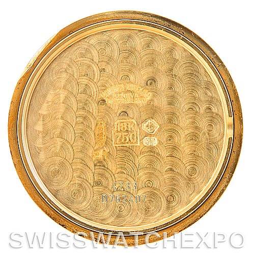 This image shows the interior case back of a Rolex Cellini 4233 Men's Yellow Gold White Dial 4233 Men's Yellow Gold White Dial watch, displaying engravings and hallmarks.