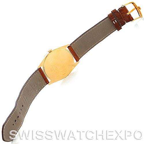 The image shows the back and strap of a Rolex Cellini 4233 Men's Yellow Gold White Dial 4233 Men's Yellow Gold White Dial watch, viewed from a slightly tilted top-down angle.