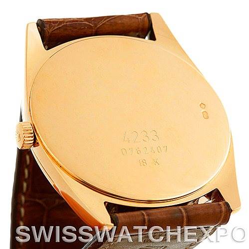 This image shows the back of a Rolex Cellini 4233 Men's Yellow Gold White Dial 4233 Men's Yellow Gold White Dial watch, emphasizing its gold case and brown leather strap.