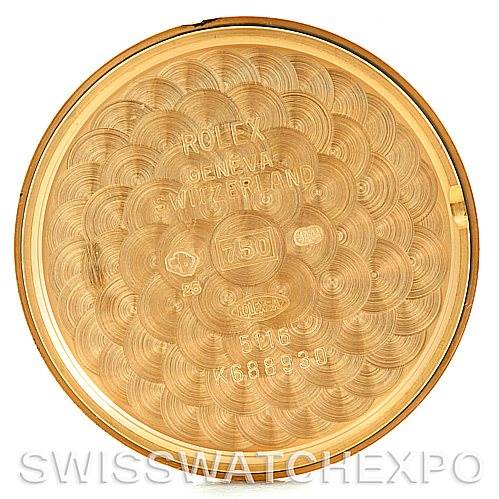 This is the inside case back of a Rolex Cellini 5116 Men's Yellow Gold Mother of Pearl Dial 5116 Men's Yellow Gold Mother of Pearl Dial watch, showcasing intricate engravings and official markings.