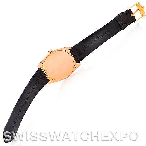 This image shows the back view of a Rolex Cellini 5320/5 Rose Gold Grey Dial 5320/5 Rose Gold Grey Dial watch, highlighting its leather strap and gold buckle.