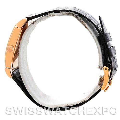 Side view of a Rolex Cellini 5320/5 Rose Gold Grey Dial 5320/5 Rose Gold Grey Dial watch showing the case, crown, and black leather strap with the buckle.