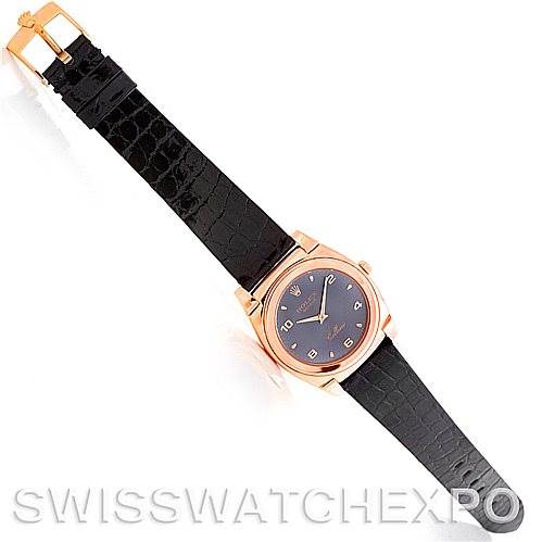 The image shows a top-down view of a Rolex Cellini 5320/5 Rose Gold Grey Dial 5320/5 Rose Gold Grey Dial watch with a black leather strap and rose gold case.