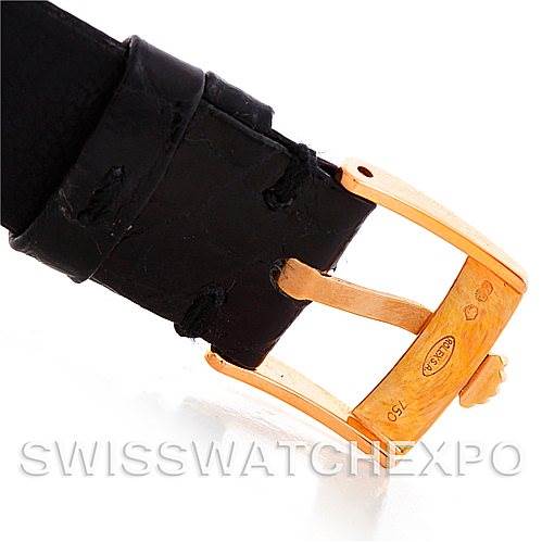 The image shows a close-up of a black leather strap and gold buckle of a Rolex Cellini 5320/5 Rose Gold Grey Dial 5320/5 Rose Gold Grey Dial watch.