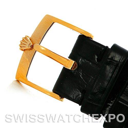 This image shows a close-up of the gold buckle and black leather strap of a Rolex Cellini 5116 Men's Yellow Gold Champagne Dial 5116 Men's Yellow Gold Champagne Dial watch.