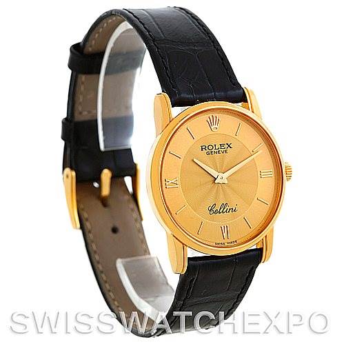 The Rolex Cellini 5116 Men's Yellow Gold Champagne Dial 5116 Men's Yellow Gold Champagne Dial watch is shown at a slight angle, revealing its gold case, dial, and black leather strap.