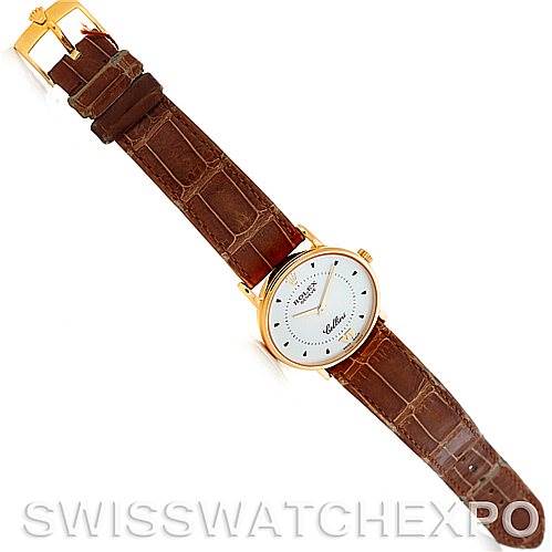 This image shows a top-down view of a Rolex Cellini 5115 Men's Yellow Gold Silver Dial 5115 Men's Yellow Gold Silver Dial watch with a brown leather strap fully extended.