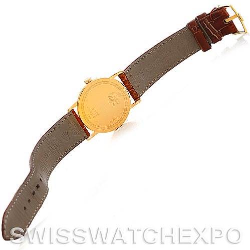 This image shows the back case and leather strap of a Rolex Cellini 5115 Men's Yellow Gold Silver Dial 5115 Men's Yellow Gold Silver Dial watch, laid out flat.