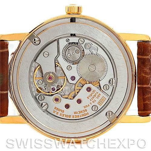 This image shows the back view of the Rolex Cellini 5115 Men's Yellow Gold Silver Dial 5115 Men's Yellow Gold Silver Dial watch, highlighting its internal mechanics and movement components.