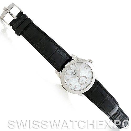 This Rolex Cellini 5240 Men's Platinum Mother of Pearl Dial 5240 Men's Platinum Mother of Pearl Dial watch is shown from an overhead angle, featuring its black leather strap, white dial, and silver buckle.