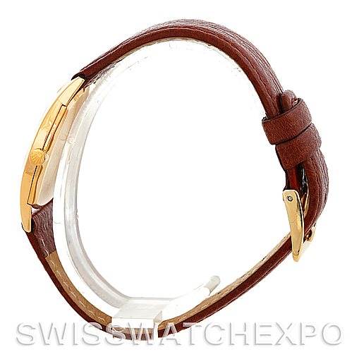 The image shows a side profile of the Rolex Cellini 3804 Men's Yellow Gold Champagne Dial 3804 Men's Yellow Gold Champagne Dial watch, featuring a brown leather strap and a gold clasp.