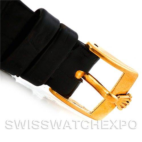 The image shows a close-up of the buckle and part of the leather strap of a Rolex Cellini Men's Yellow Gold Black Dial Men's Yellow Gold Black Dial watch, focusing on the gold buckle.