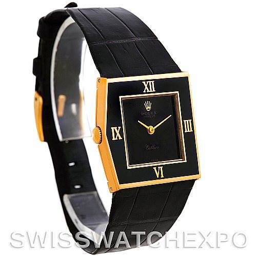 The image shows a gold and black square-faced Rolex Cellini Men's Yellow Gold Black Dial Men's Yellow Gold Black Dial watch at a slight side angle, highlighting its dial and strap.