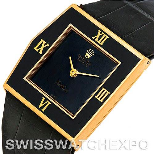 The image shows a close-up angled view of the Rolex Cellini Men's Yellow Gold Black Dial Men's Yellow Gold Black Dial watch, highlighting the face, Roman numerals, and a portion of the leather strap.