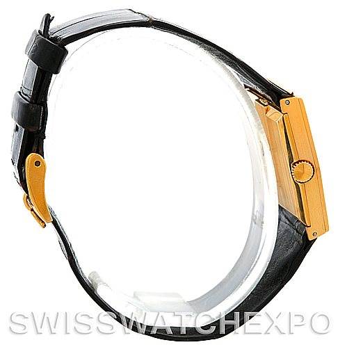 The image shows a side view of a Rolex Cellini Men's Yellow Gold Black Dial Men's Yellow Gold Black Dial watch, highlighting its gold case, crown, and black leather strap.