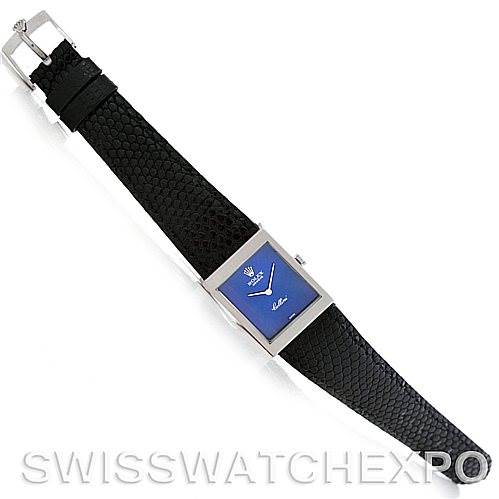 This image shows a top-down view of a Rolex Cellini 4014 Men
s White Gold Blue Dial 4014 Men
s White Gold Blue Dial watch with a blue dial and black leather strap.