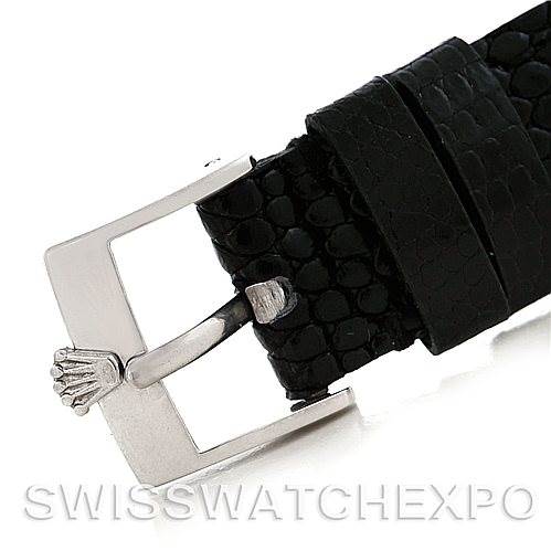 The image depicts a close-up of the buckle and part of the black leather strap of a Rolex Cellini 4014 Men
s White Gold Blue Dial 4014 Men
s White Gold Blue Dial watch.