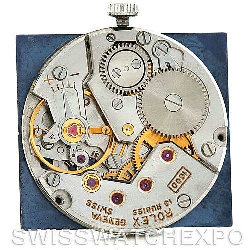 This is an overhead view of the internal movement of a Rolex Cellini 4014 Men
s White Gold Blue Dial 4014 Men
s White Gold Blue Dial watch, showing gears, jewel bearings, and the winding crown.