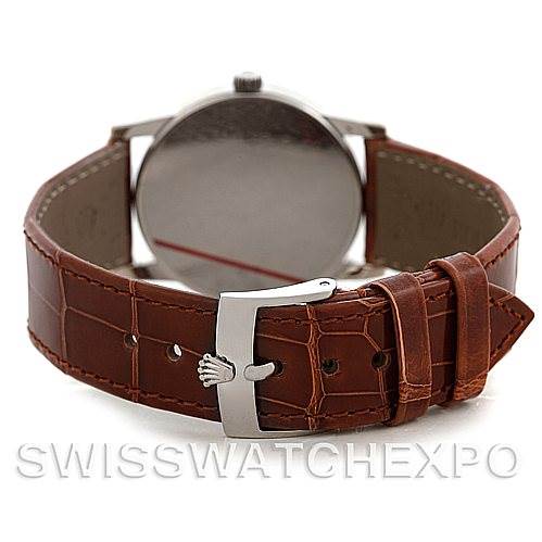 The image shows the back of a Rolex Cellini 5116 Men's White Gold Silver Dial 5116 Men's White Gold Silver Dial watch, highlighting its brown leather strap and stainless steel clasp.