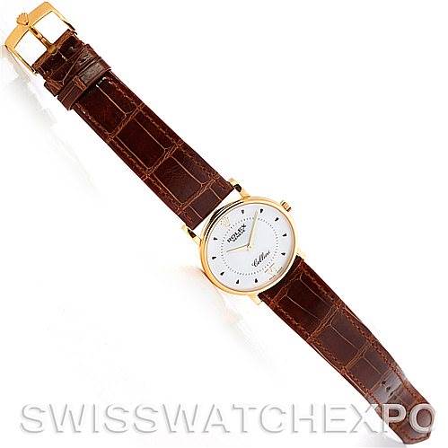 This image shows a full-view angle of the Rolex Cellini 5115 Men's Yellow Gold Silver Dial 5115 Men's Yellow Gold Silver Dial watch, highlighting the face, brown leather strap, and gold buckle.