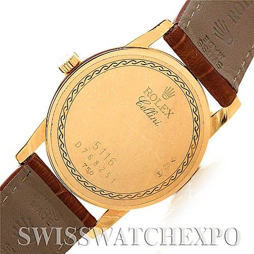 The image shows the back case of a Rolex Cellini 5116 Men
s Yellow Gold Champagne Dial 5116 Men
s Yellow Gold Champagne Dial model watch, including its leather straps and engravings.