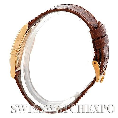 The image shows a side view of the Rolex Cellini 5116 Men
s Yellow Gold Champagne Dial 5116 Men
s Yellow Gold Champagne Dial watch, highlighting the brown leather strap and gold buckle.