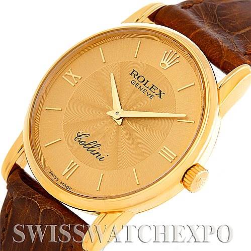 This image shows a Rolex Cellini 5116 Men
s Yellow Gold Champagne Dial 5116 Men
s Yellow Gold Champagne Dial watch angled to display the gold dial, Roman numerals, crown, and brown leather strap.