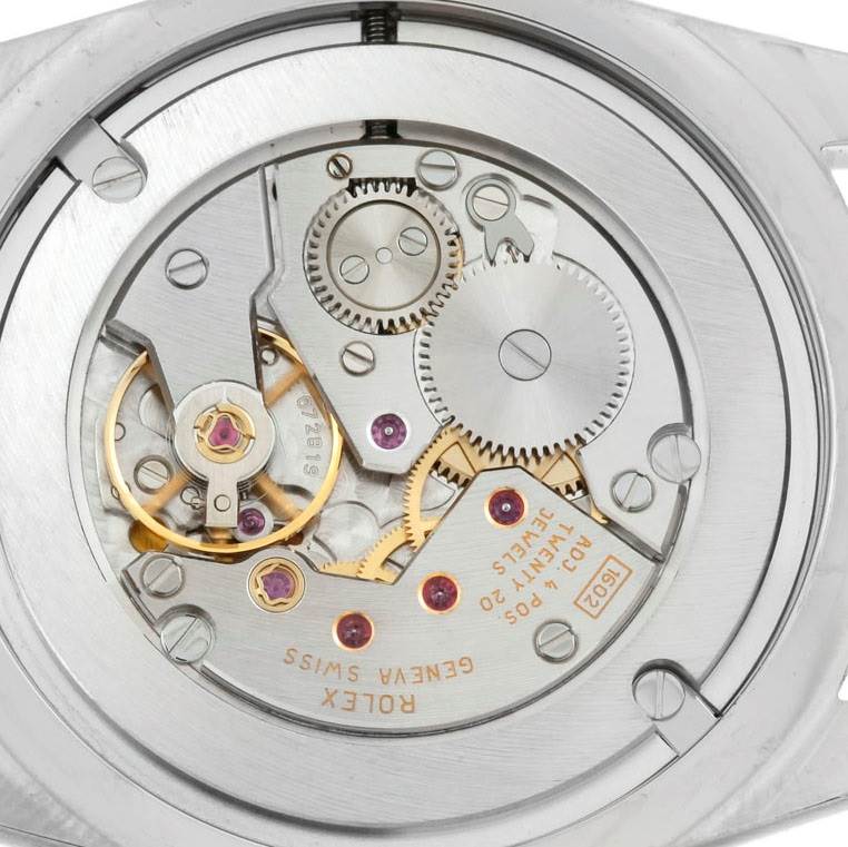 The image shows the back view of the Rolex Cellini 4233 Men's White Gold White Dial 4233 Men's White Gold White Dial watch, highlighting its intricate movement mechanism.
