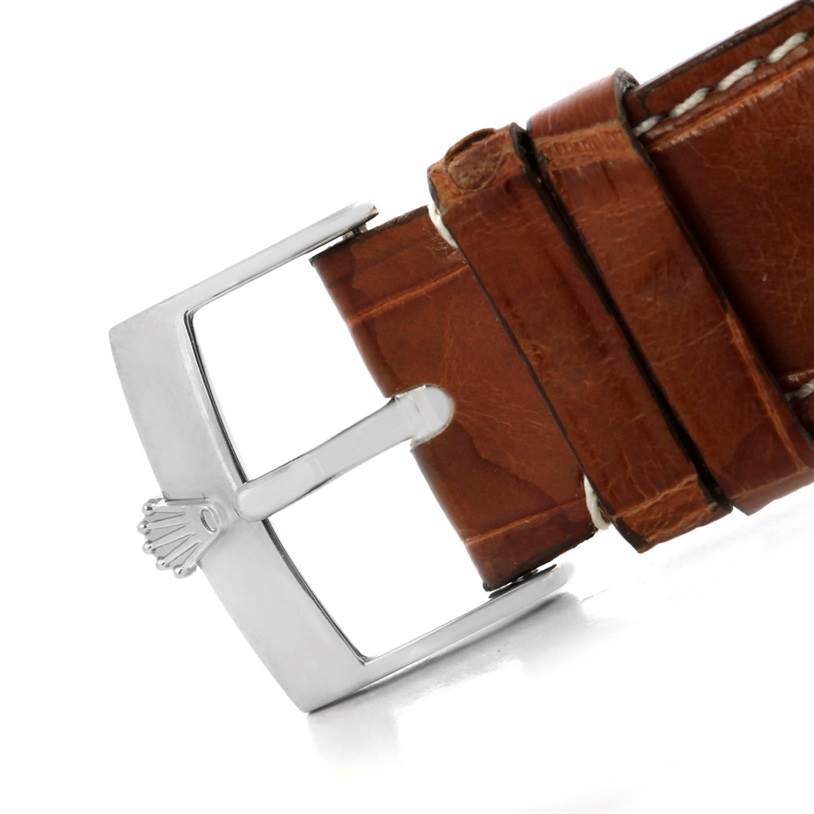 This image shows a close-up of the buckle and leather strap of a Rolex Cellini 4233 Men's White Gold White Dial 4233 Men's White Gold White Dial model watch from a side angle.