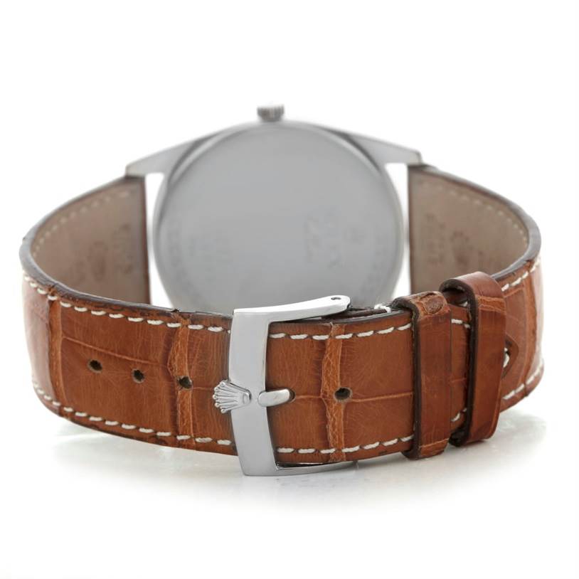 The image shows the back view of a Rolex Cellini 4233 Men's White Gold White Dial 4233 Men's White Gold White Dial watch, highlighting its brown leather strap and buckle.