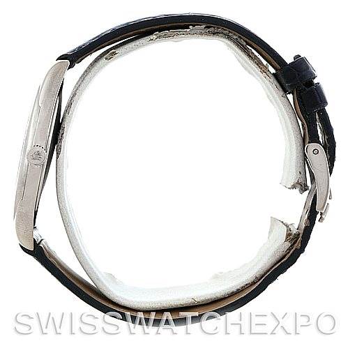 The Rolex Cellini 4233 Men's White Gold White Dial 4233 Men's White Gold White Dial watch is shown from a side angle, displaying its case, bezel, crown, and strap.