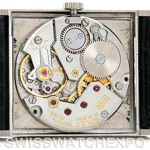 The image shows the internal mechanism and gears of a Rolex Cellini 4014 Men's White Gold Black Dial 4014 Men's White Gold Black Dial watch, viewed from the back with the case opened.