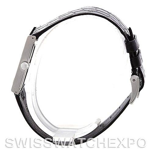 The image shows a side profile of a Rolex Cellini 4014 Men's White Gold Black Dial 4014 Men's White Gold Black Dial model, highlighting its slim case and black leather strap.