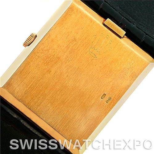 This image shows the back case of a Rolex Cellini 4027 Men's Yellow Gold Champagne Dial 4027 Men's Yellow Gold Champagne Dial watch at a slight angle, highlighting the crown logo and hallmarks.