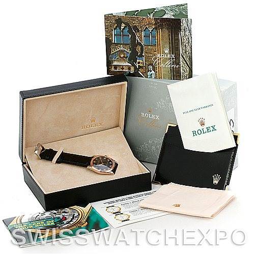 This image shows a Rolex Cellini 4233 Men's White Gold Black Dial 4233 Men's White Gold Black Dial watch at an angle with its box, papers, manual, and accessories displayed.