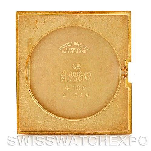 This image shows the back case of a Rolex Cellini 4105 Men's Yellow Gold Black Dial 4105 Men's Yellow Gold Black Dial watch, highlighting the inscriptions and material markings.