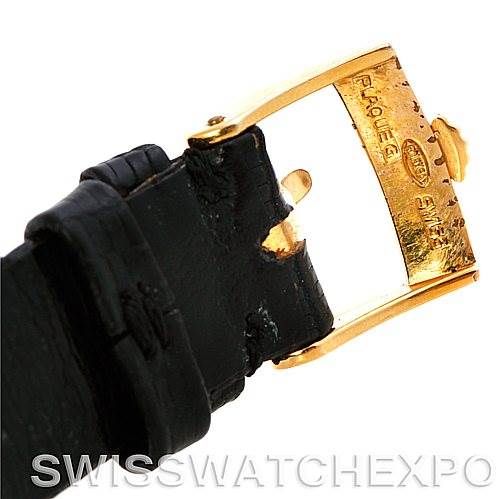 This image shows a close-up of the clasp and part of the leather strap of a Rolex Cellini 4105 Men's Yellow Gold Black Dial 4105 Men's Yellow Gold Black Dial watch.