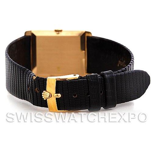 This image shows the back of the Rolex Cellini 4105 Men's Yellow Gold Black Dial 4105 Men's Yellow Gold Black Dial watch, focusing on the black leather strap and gold clasp with the Rolex crown logo.