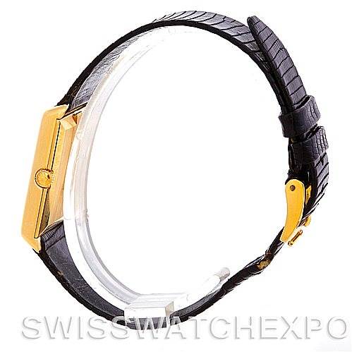 The image shows a side view of a Rolex Cellini 4105 Men's Yellow Gold Black Dial 4105 Men's Yellow Gold Black Dial watch, highlighting the gold case, black leather strap, and buckle.