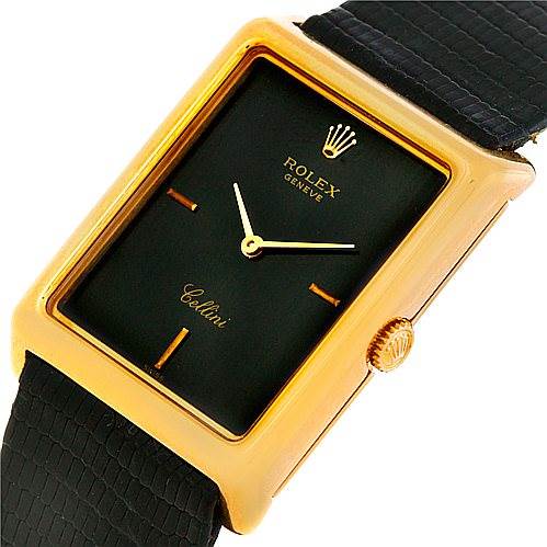 The image shows a close-up angle of a Rolex Cellini 4105 Men's Yellow Gold Black Dial 4105 Men's Yellow Gold Black Dial watch highlighting its dial, crown, and part of the strap.