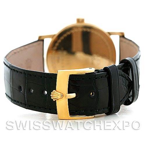 The image shows the back view of a Rolex Cellini 5115 Men's Yellow Gold Beige Dial 5115 Men's Yellow Gold Beige Dial watch, focusing on its black leather strap and gold buckle.