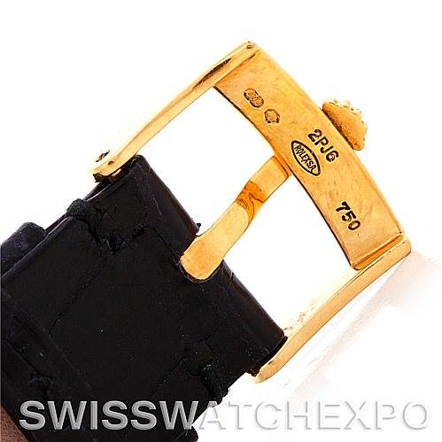 The image shows a close-up of the clasp area of a Rolex Cellini 5115 Men's Yellow Gold Beige Dial 5115 Men's Yellow Gold Beige Dial watch, highlighting the gold buckle and part of the black strap.